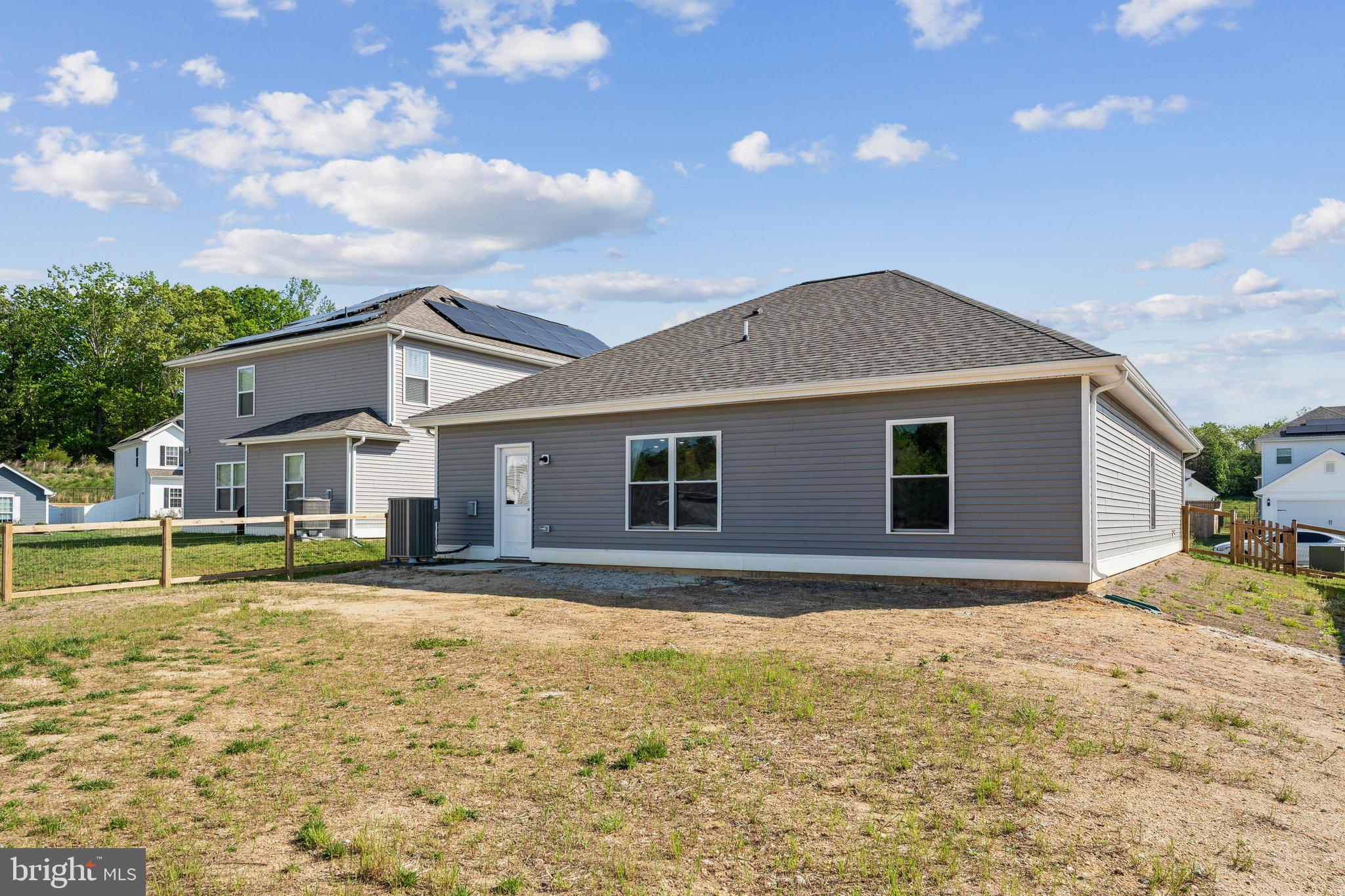 17026 Rollins Road Bowling Green, VA 22427 - Photo 4 of 19 a view of a house with a yard