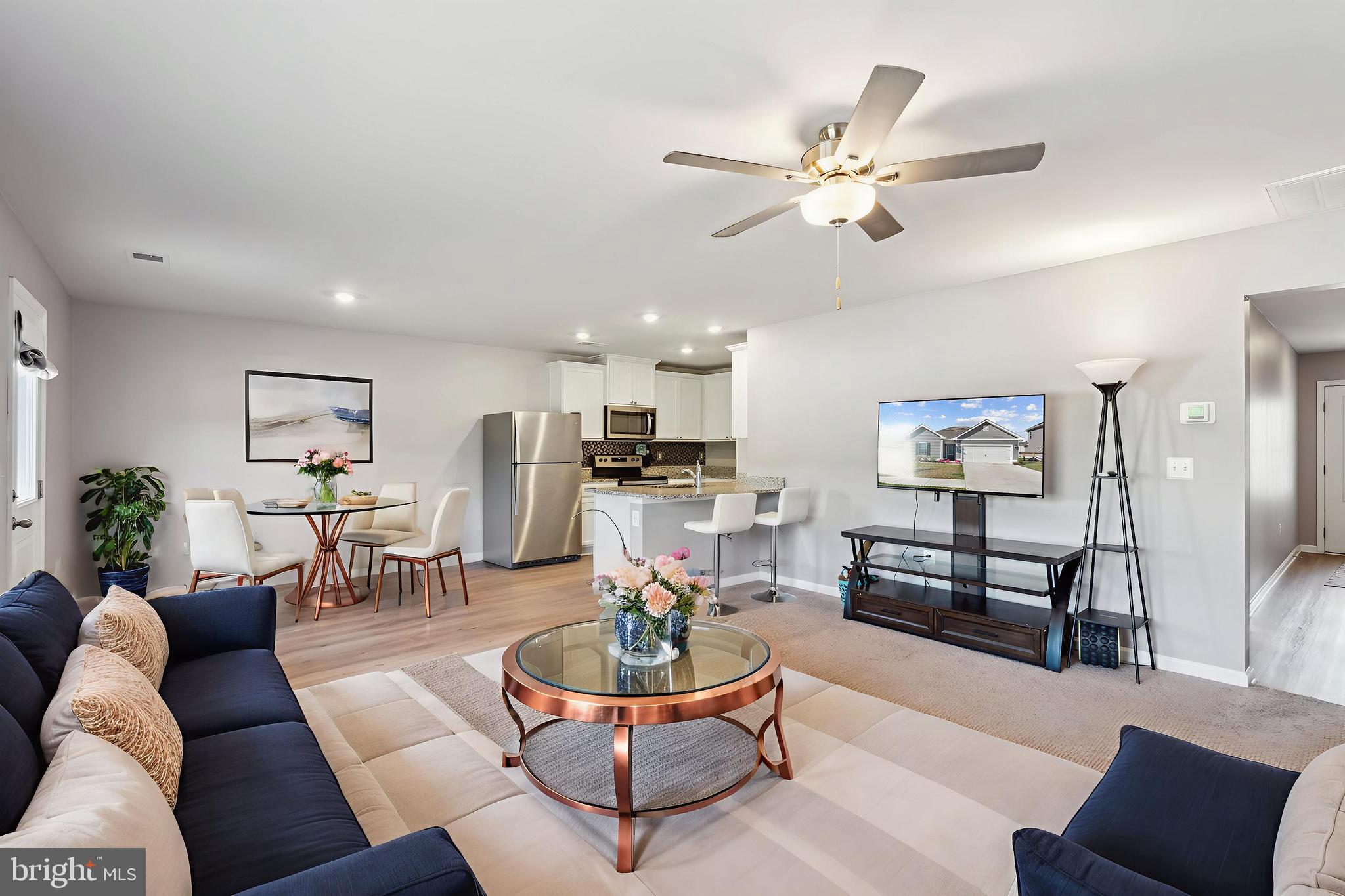 17026 Rollins Road Bowling Green, VA 22427 - Photo 6 of 19 a living room with furniture and view of kitchen
