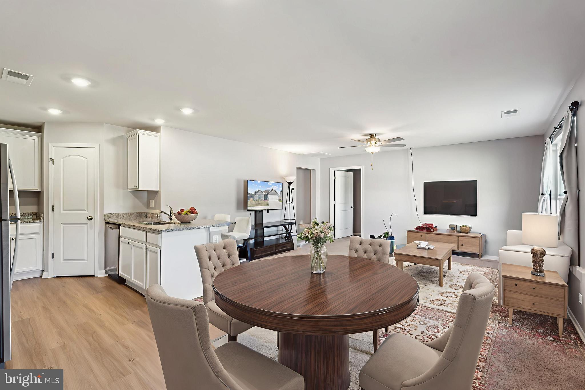 17026 Rollins Road Bowling Green, VA 22427 - Photo 7 of 19 a large kitchen with a table and chairs