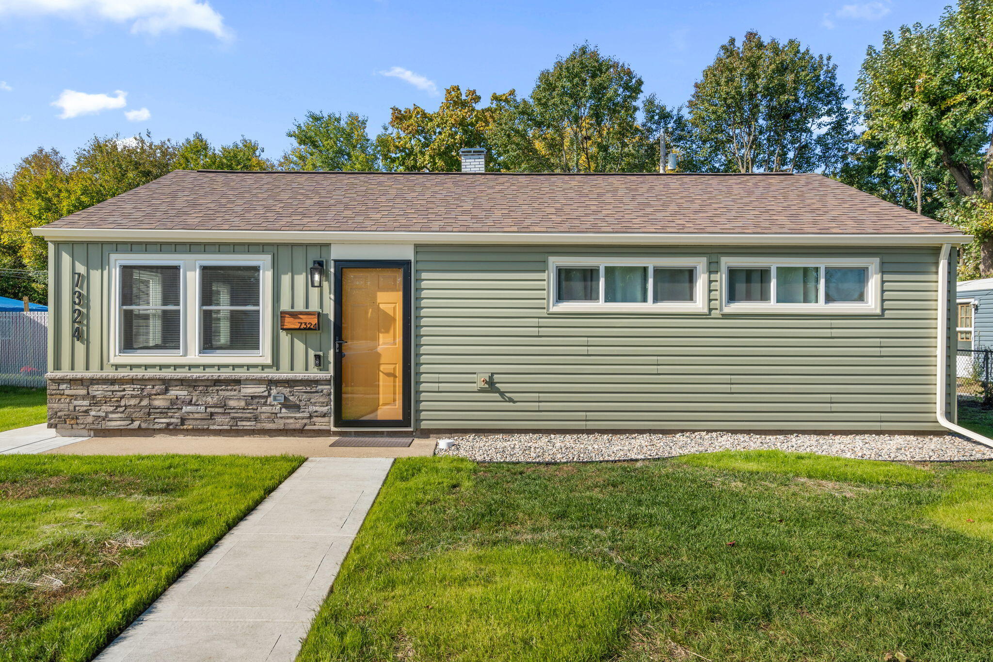 7324 Walnut Avenue Hammond, IN 46324 - Photo 14 of 19 a front view of a house with a garden