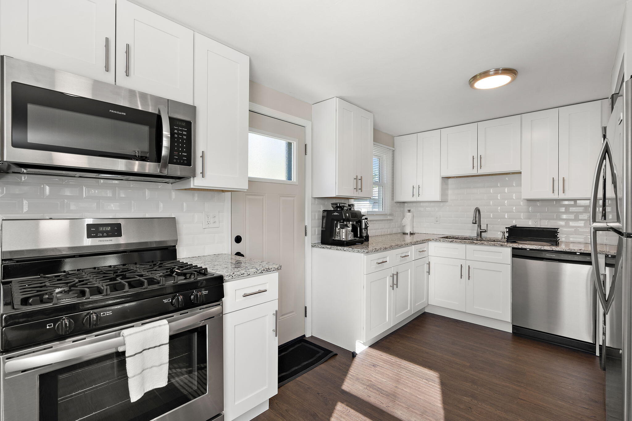 7324 Walnut Avenue Hammond, IN 46324 - Photo 6 of 19 a kitchen with stainless steel appliances a white cabinet and a stove top oven