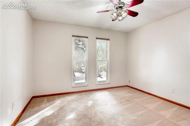 4672 Ranch Drive Colorado Springs, CO 80918 - Photo 13 of 27 The second bedroom also has lots of natural light and ceiling fan.