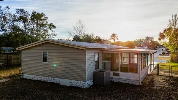 an empty room with large windows