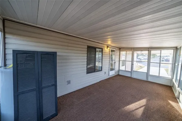a kitchen with a refrigerator and a stove