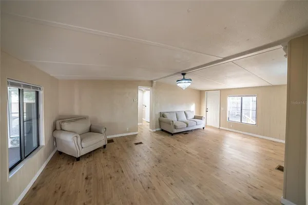 a bathroom with a toilet shower and a window