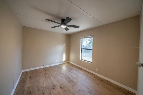 a view of an empty room and window