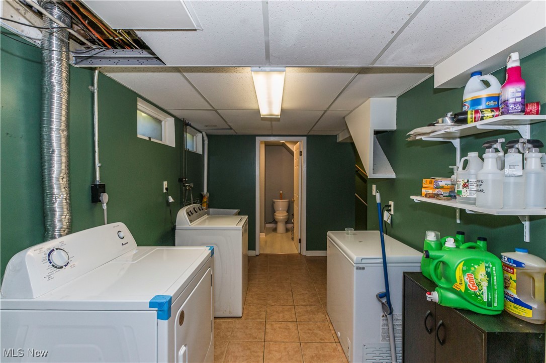 2113 Stabler Road Akron, OH 44313 - Photo 31 of 39 Laundry area featuring a drop ceiling, washer and clothes dryer, and light tile patterned flooring