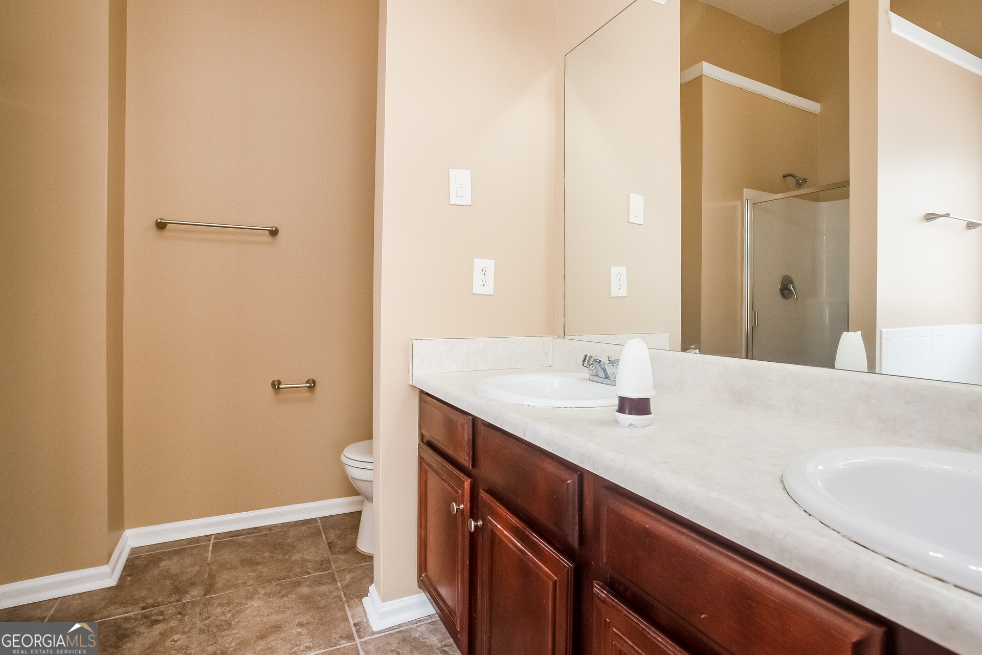 8311 Champion Trail Fairburn, GA 30213 - Photo 9 of 17 a bathroom with a sink and a mirror