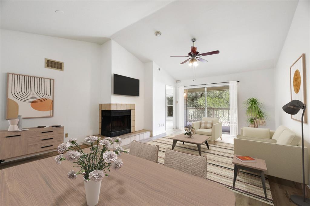 a living room with furniture fireplace and window
