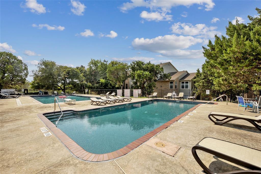 2450 Wickersham Lane, Unit 106 Austin, TX 78741 - Photo 13 of 13 a view of swimming pool from a lounge chair