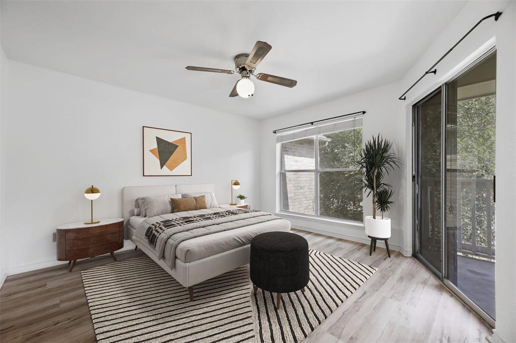 2450 Wickersham Lane, Unit 106 Austin, TX 78741 - Photo 3 of 13 a bedroom with a large bed and a window