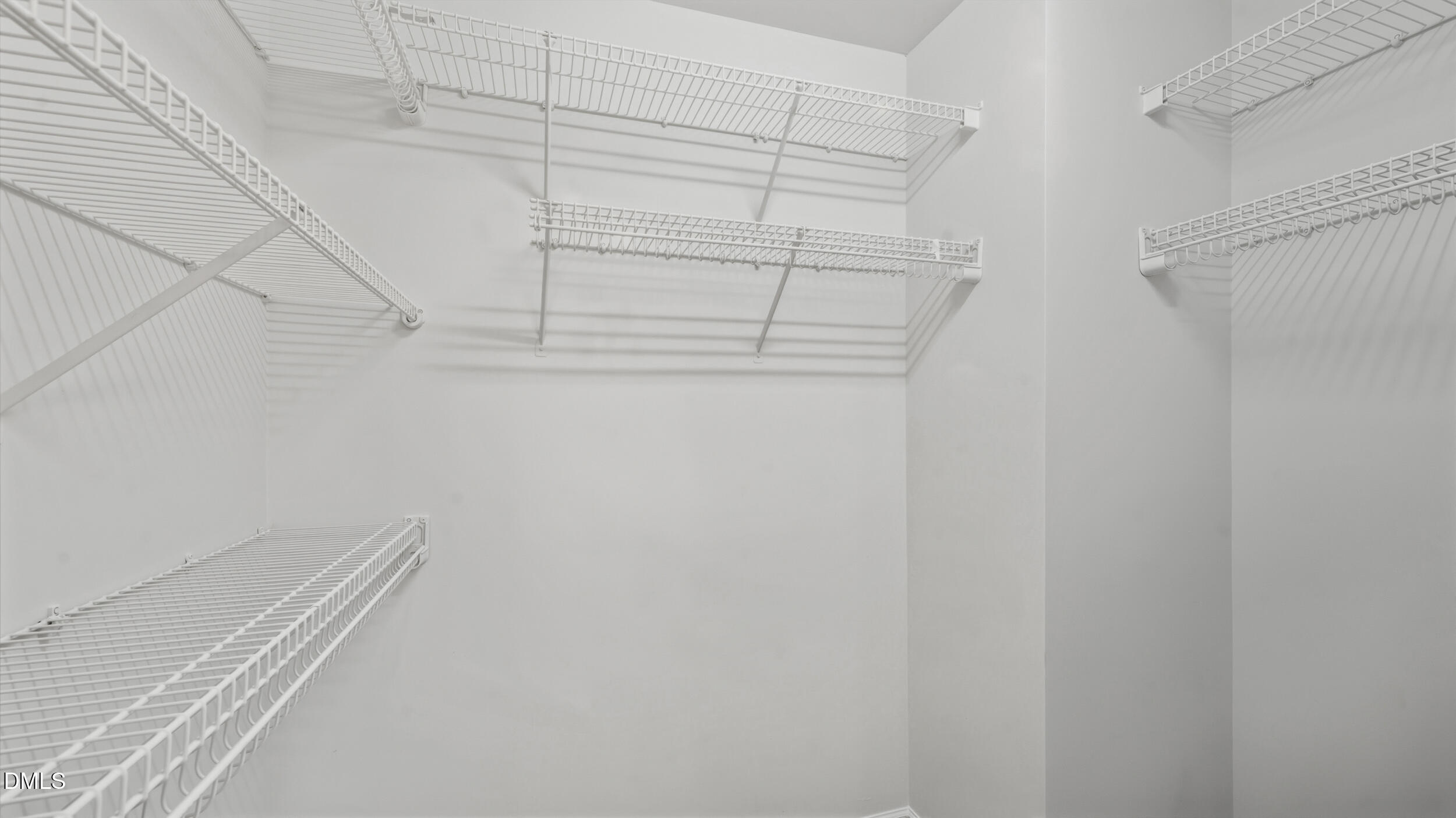 8005 Mill Bluff Court Raleigh, NC 27616 - Photo 22 of 47 Spacious closet with built in shelving for organized storage.