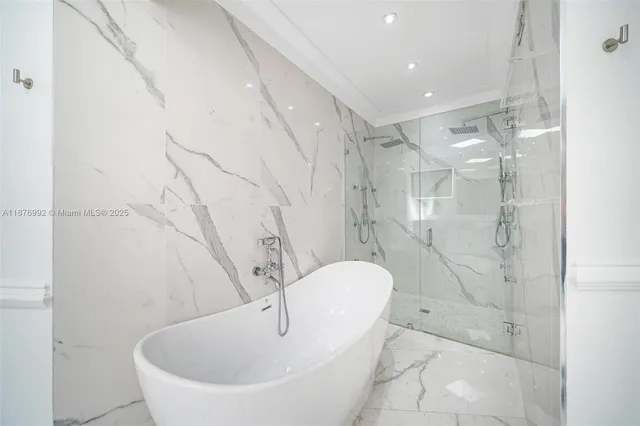 a spacious bathroom with a bathtub and shower