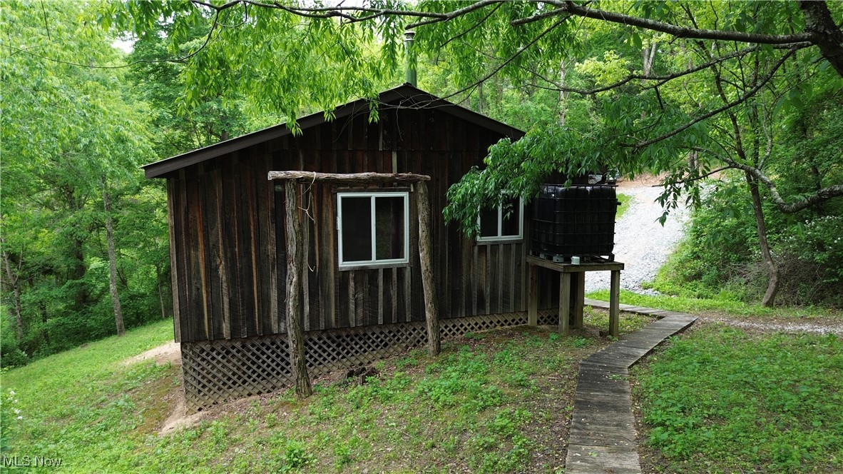 34215 Mt Hope Ridge Road Graysville, OH 45734 - Photo 24 of 50 View of outbuilding featuring a wooded view