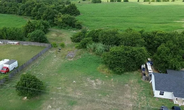 a view of a lake with a yard