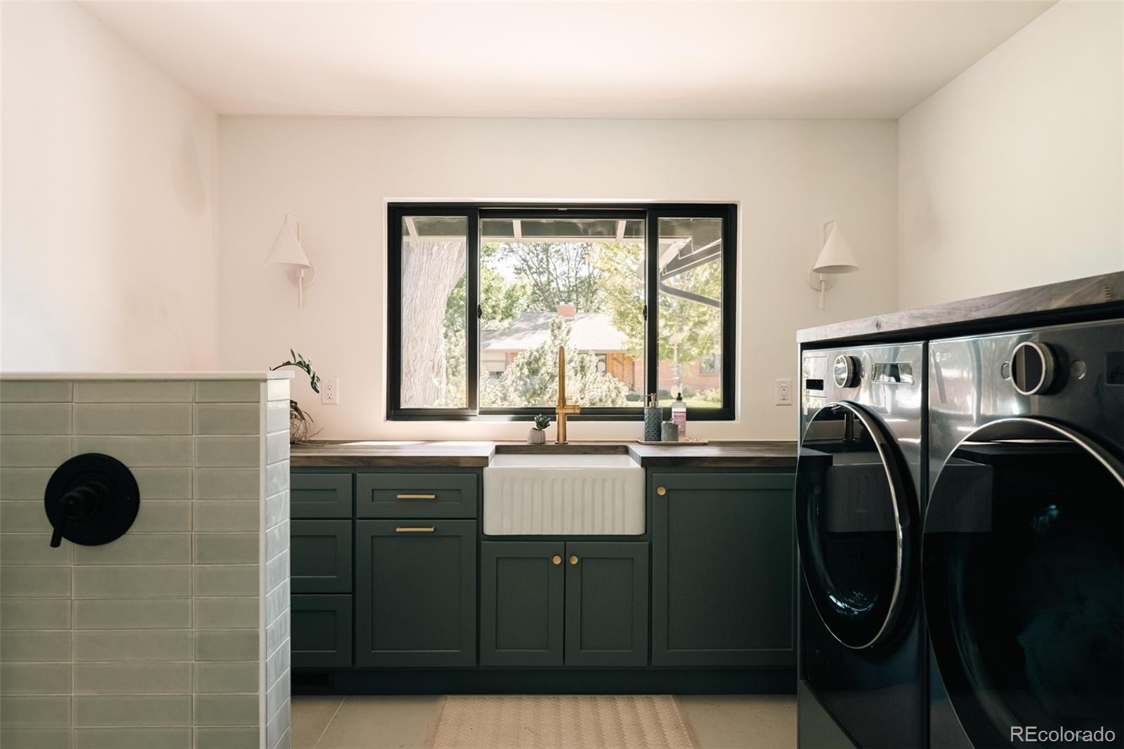 2745 Deframe Road Golden, CO 80401 - Photo 13 of 50 a bathroom with a sink toilet and mirror