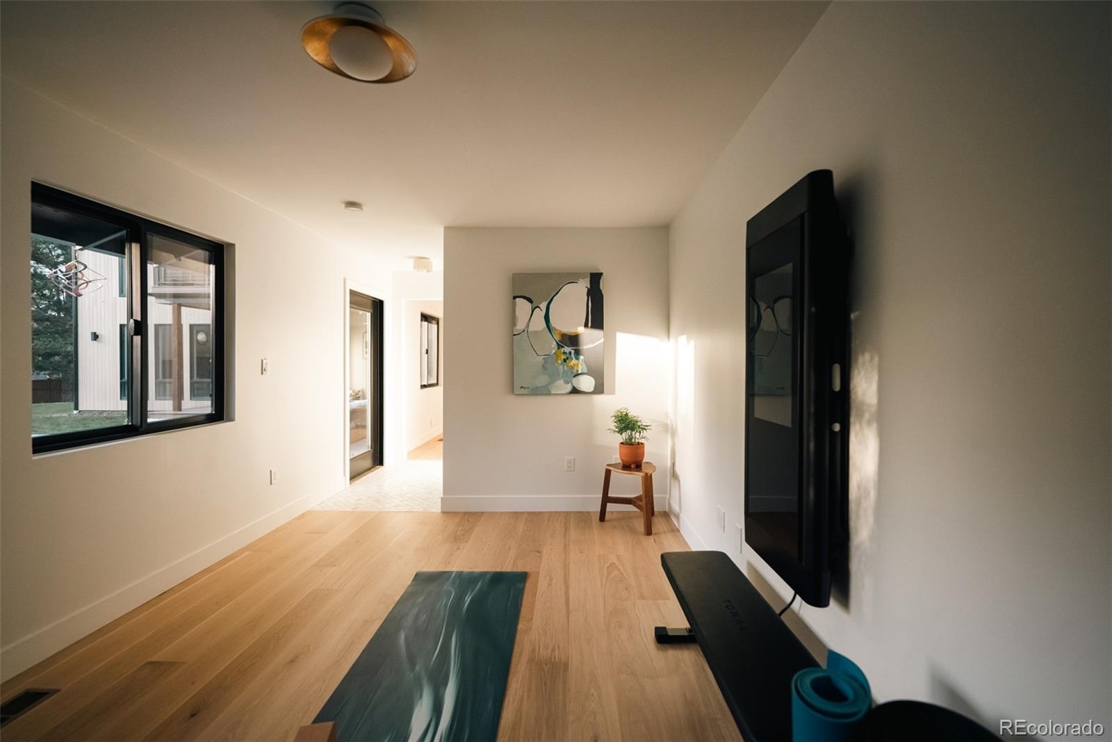 2745 Deframe Road Golden, CO 80401 - Photo 14 of 50 a living room with furniture and a flat screen tv