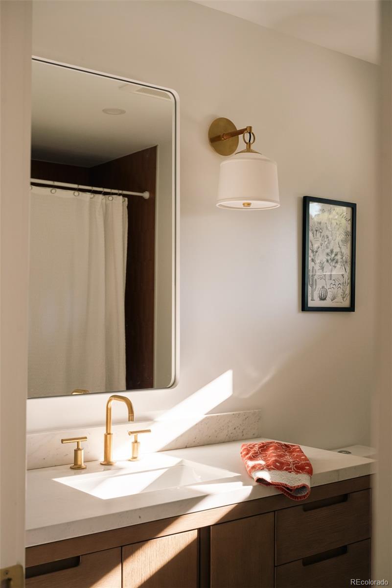 2745 Deframe Road Golden, CO 80401 - Photo 16 of 50 a bathroom with a sink and a mirror