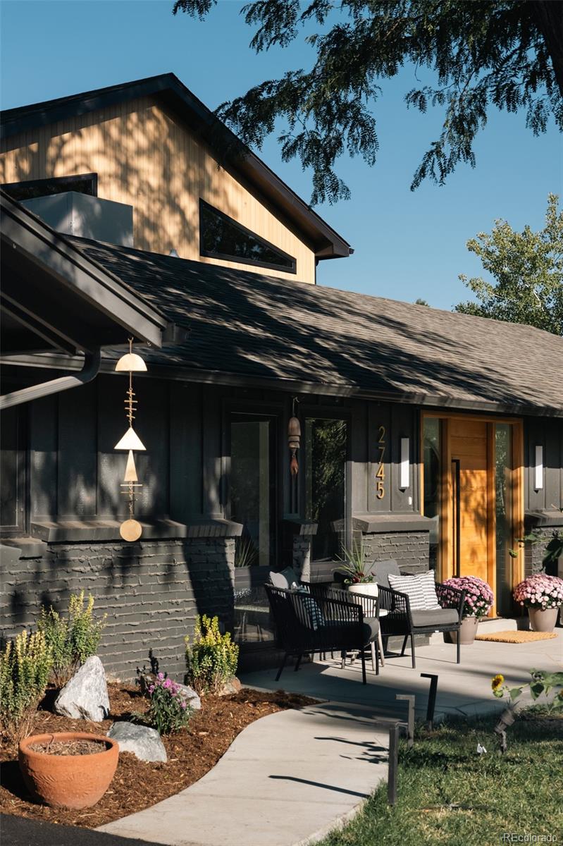 2745 Deframe Road Golden, CO 80401 - Photo 2 of 50 a view of a chairs and a table in backyard