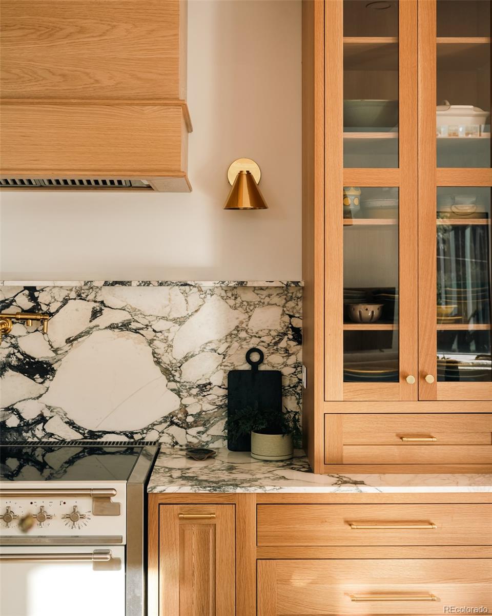 2745 Deframe Road Golden, CO 80401 - Photo 23 of 50 a bathroom with a granite countertop sink and a stove