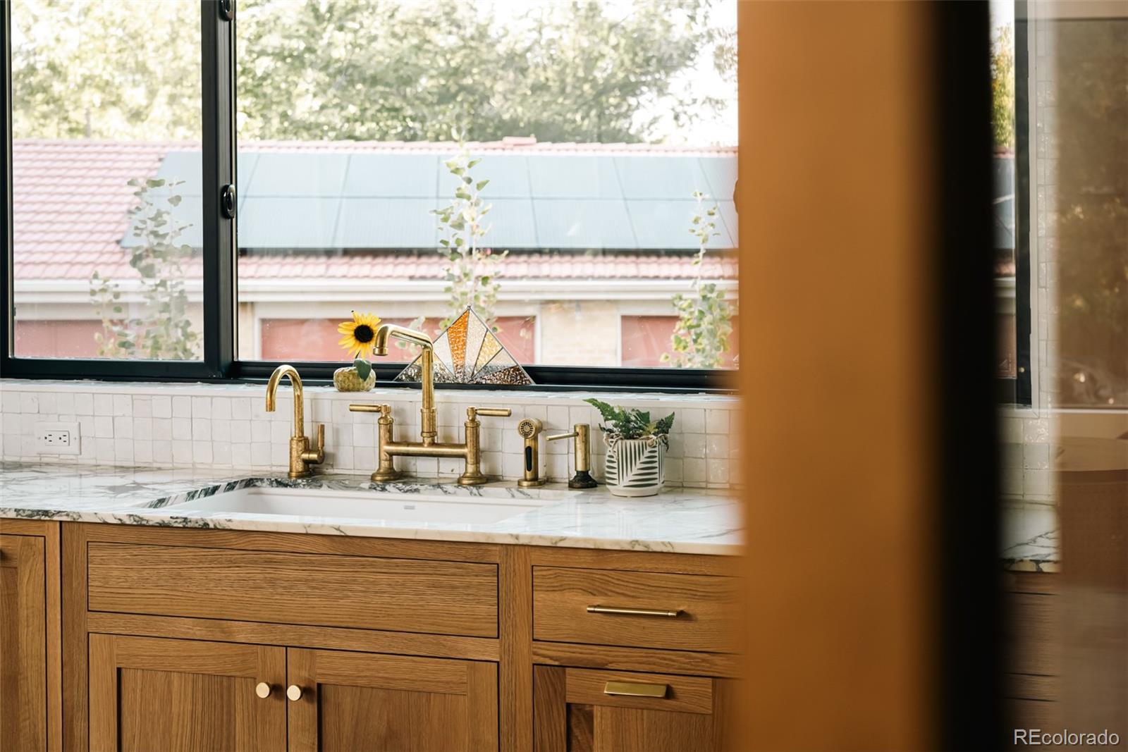 2745 Deframe Road Golden, CO 80401 - Photo 25 of 50 a bathroom with a sink and a window