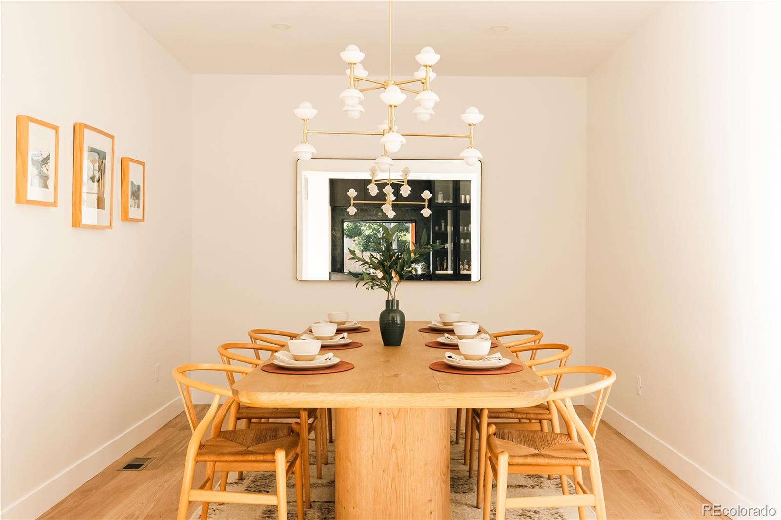 2745 Deframe Road Golden, CO 80401 - Photo 28 of 50 a view of a dining room with furniture and chandelier