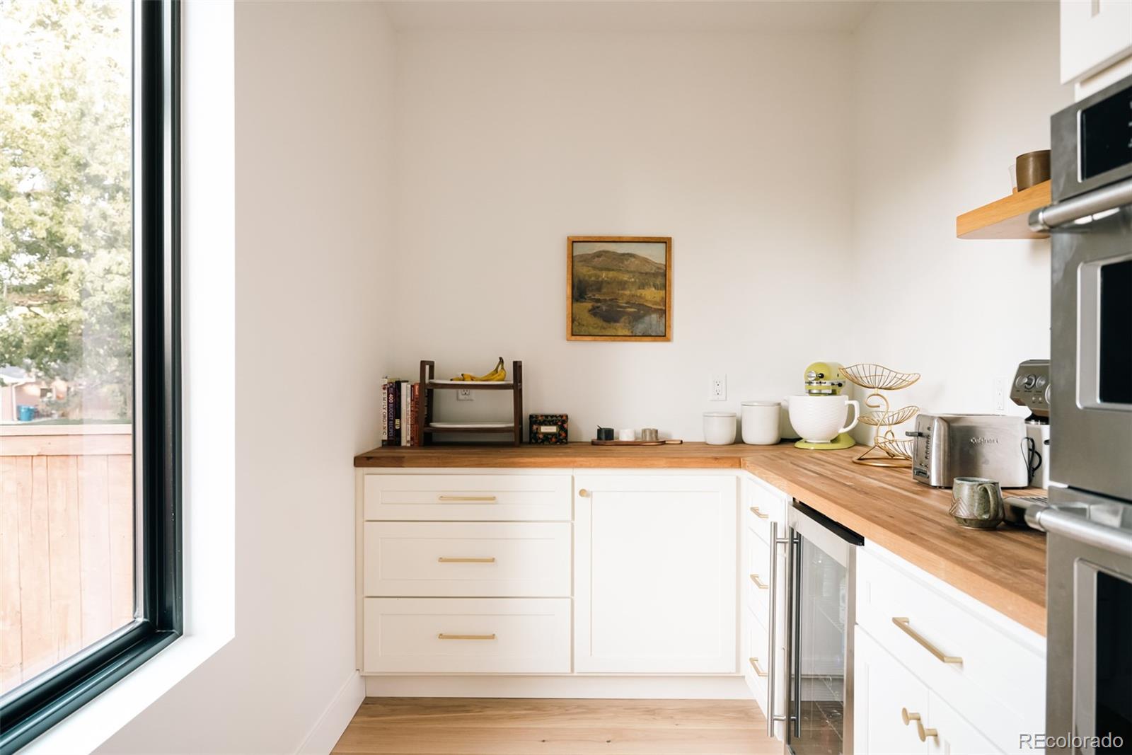 2745 Deframe Road Golden, CO 80401 - Photo 29 of 50 a kitchen with granite countertop a sink and a stove top oven