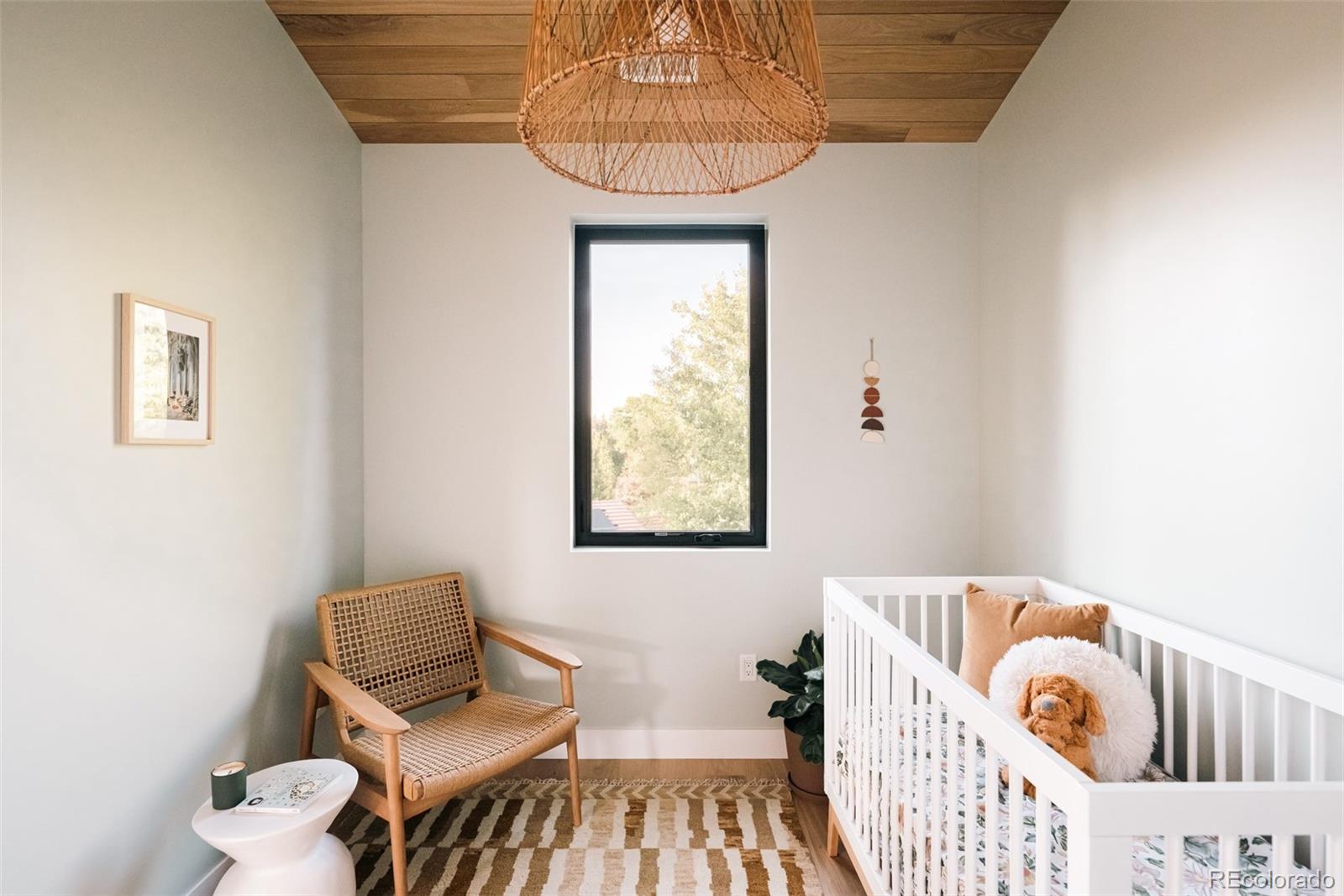 2745 Deframe Road Golden, CO 80401 - Photo 43 of 50 a bedroom with a bed and window