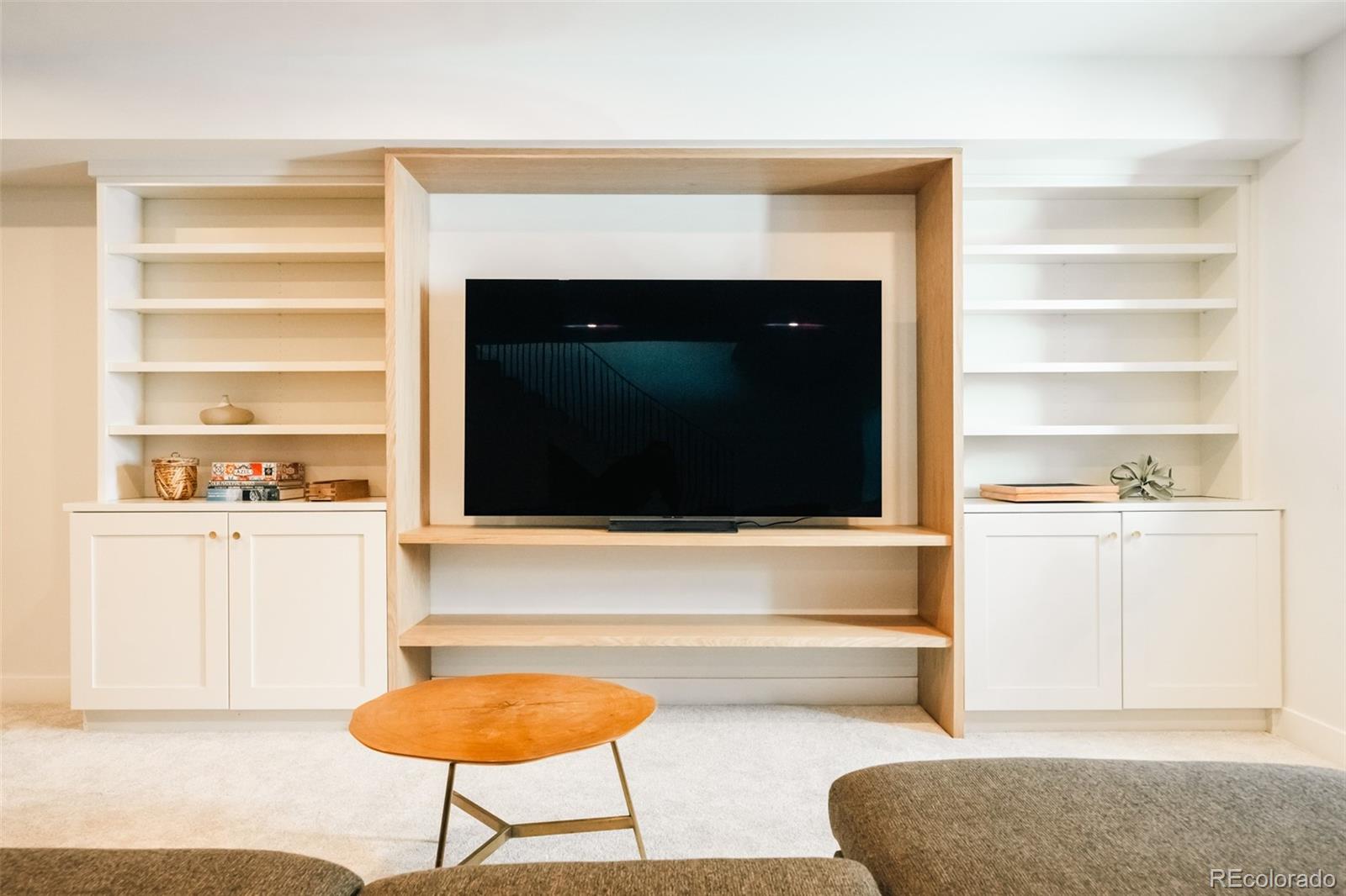 2745 Deframe Road Golden, CO 80401 - Photo 45 of 50 a living room with a fireplace and a flat screen tv