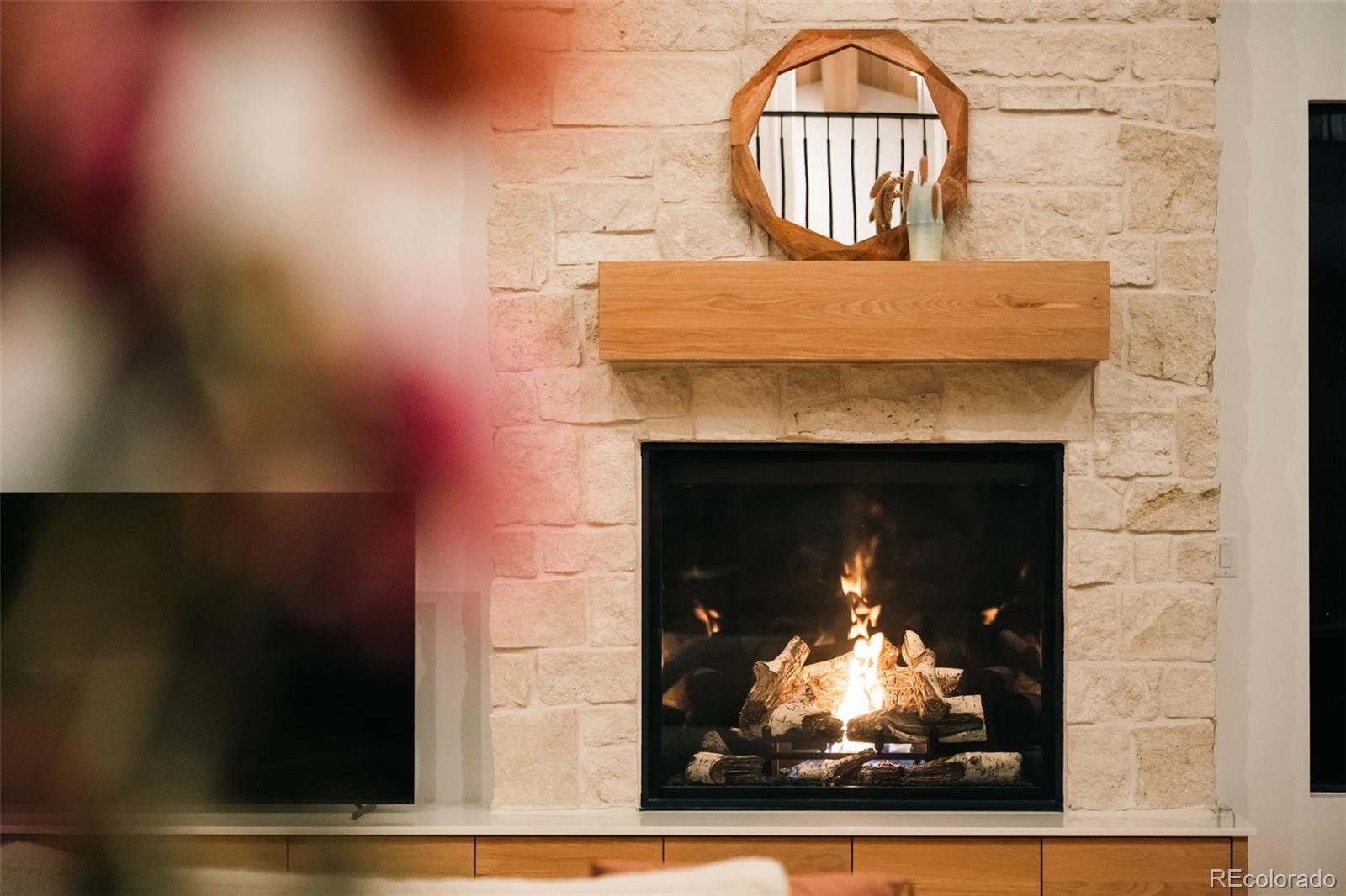2745 Deframe Road Golden, CO 80401 - Photo 46 of 50 a view of fireplace with wooden floor