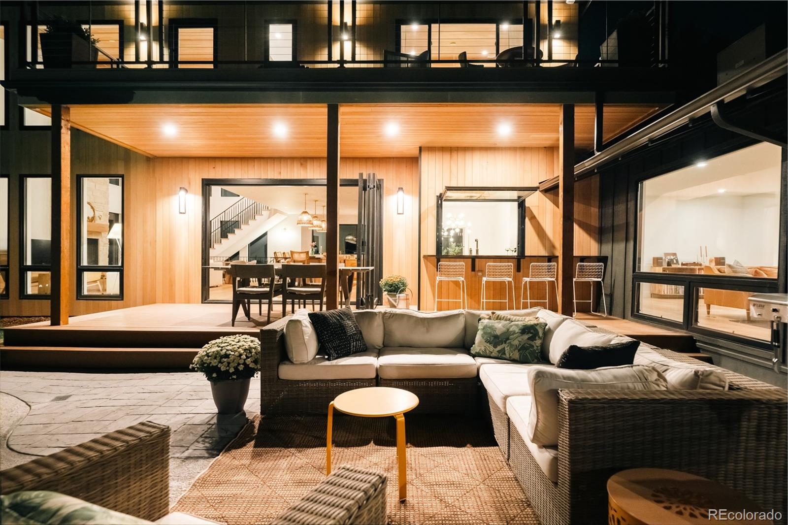 2745 Deframe Road Golden, CO 80401 - Photo 49 of 50 a living room with furniture and a floor to ceiling window