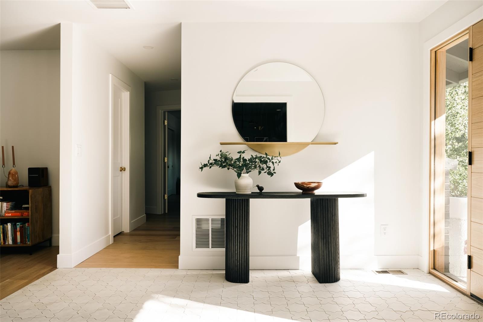 2745 Deframe Road Golden, CO 80401 - Photo 5 of 50 a living room with furniture a flat screen tv and a fireplace