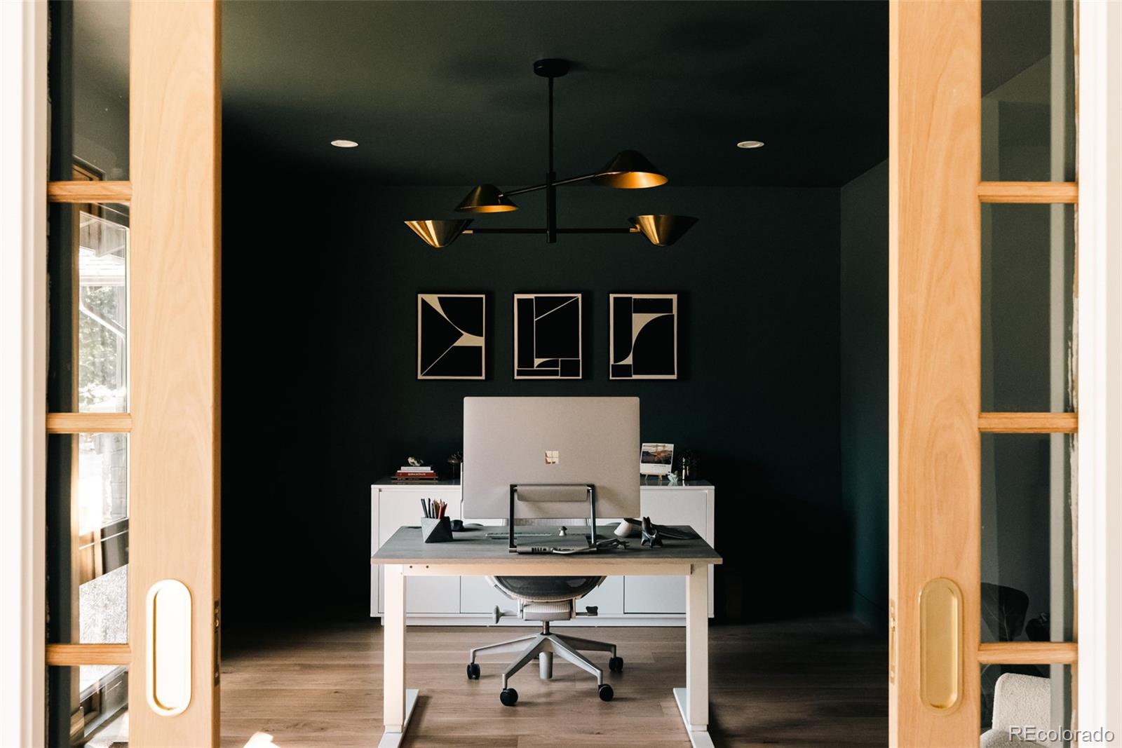 2745 Deframe Road Golden, CO 80401 - Photo 6 of 50 a workspace with furniture and wooden floor