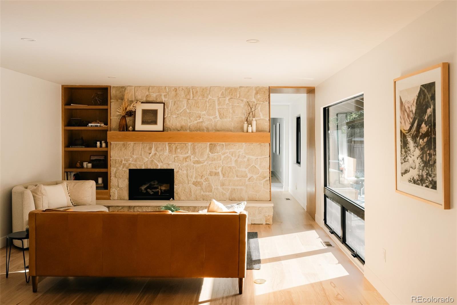 2745 Deframe Road Golden, CO 80401 - Photo 7 of 50 a living room with furniture wooden floor and a fireplace