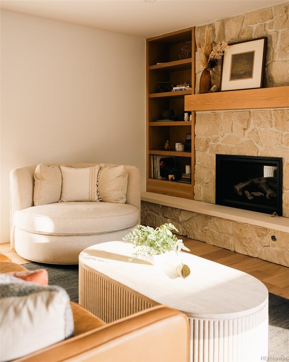 2745 Deframe Road Golden, CO 80401 - Photo 10 of 50 a living room with furniture and a fireplace