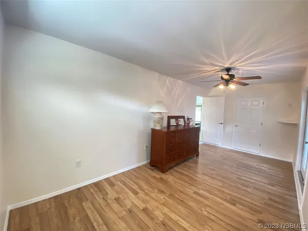 a bathroom with a sink a toilet a mirror and shower