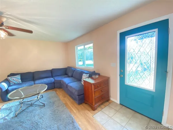 a living room with furniture and a window