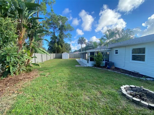 front view of a house with a garden