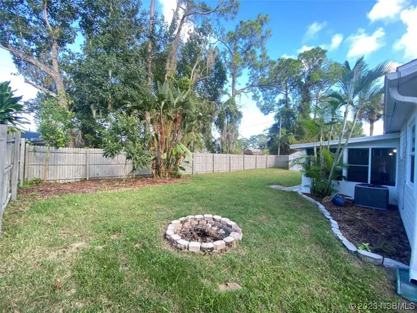 a view of house with yard