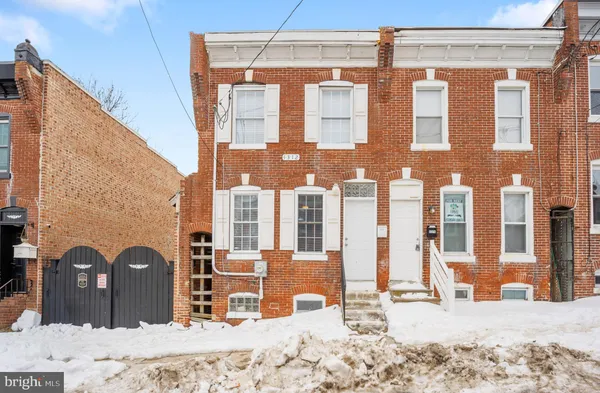 a view of a house with a snow in the background