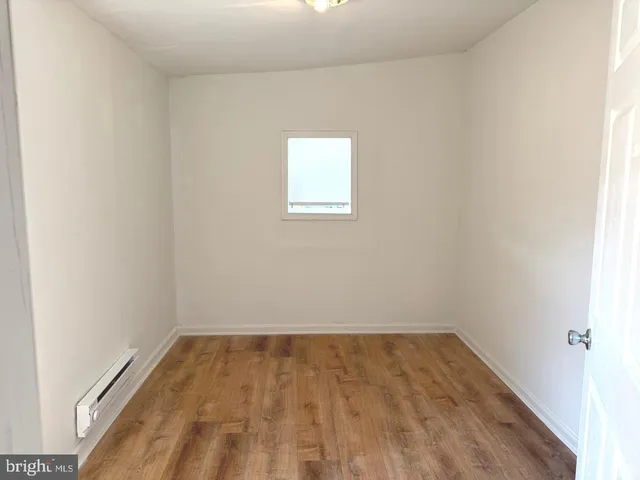 a bathroom with a shower and a bath tub