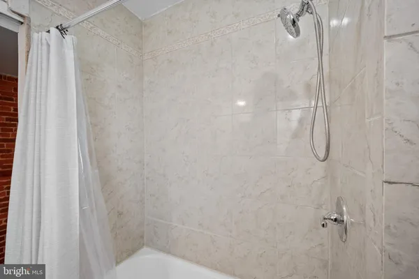 a bathroom with a shower curtain