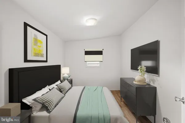 a bedroom with a bed and couch