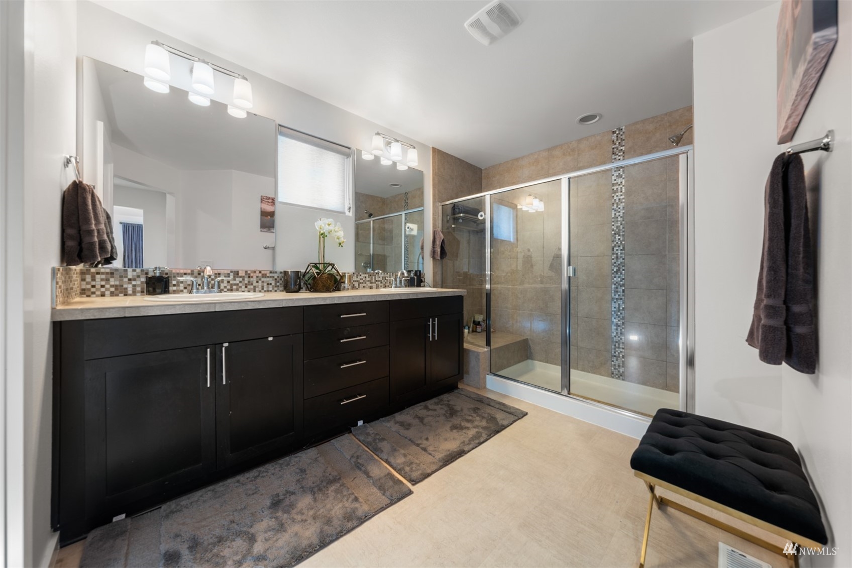1413 South 28th Street Renton, WA 98055 - Photo 13 of 20 a bathroom with a sink double vanity and a shower