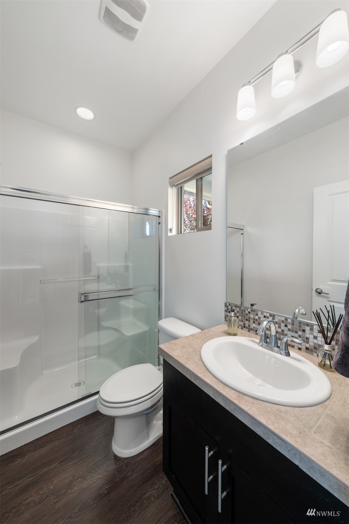 1413 South 28th Street Renton, WA 98055 - Photo 10 of 20 a bathroom with a sink a toilet and shower