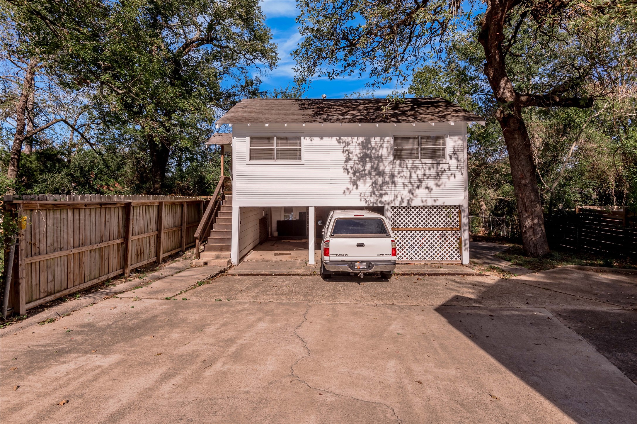 1312 20th Street, Unit GA Huntsville, TX 77340 - Photo 1 of 11 a view of a car park in front of house