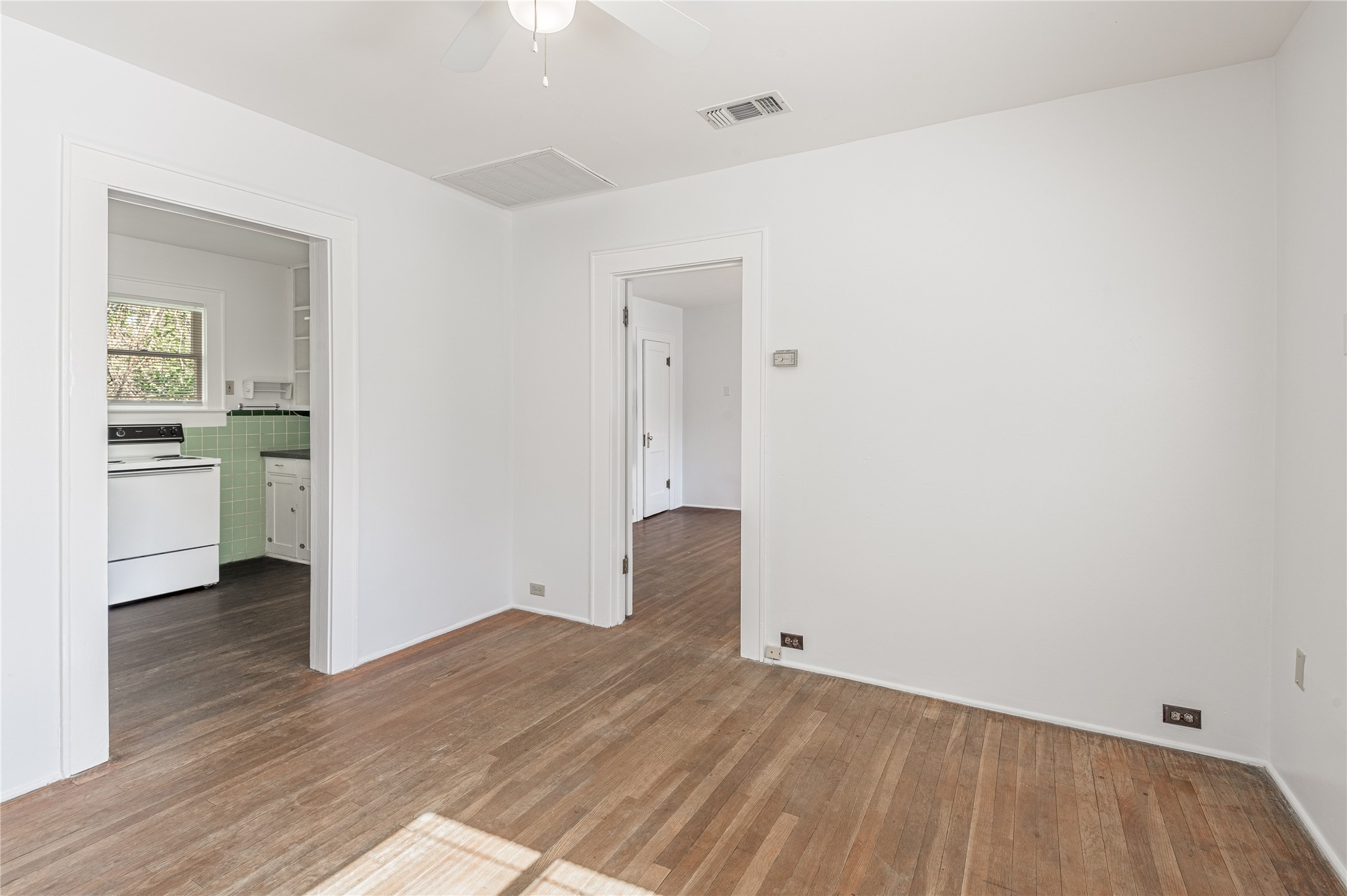 1312 20th Street, Unit GA Huntsville, TX 77340 - Photo 5 of 11 a view of empty room with wooden floor
