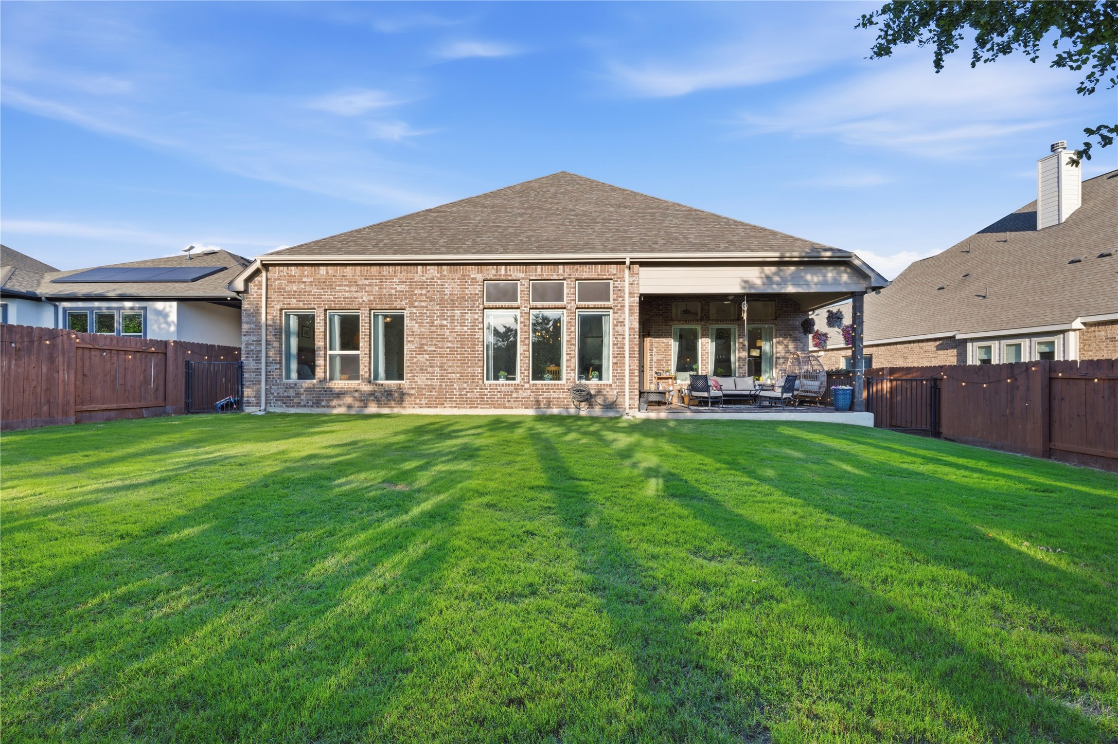 138 Rpd Spgs Cove Georgetown, TX 78628 - Photo 35 of 37 a front view of a house with a yard table and chairs