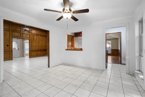 a view of a kitchen with a sink and large windows