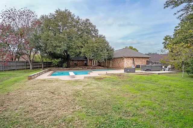 a view of a house with swimming pool